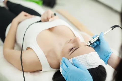 Close-up top-view side-view portrait of a young woman with a tow Stock Photos