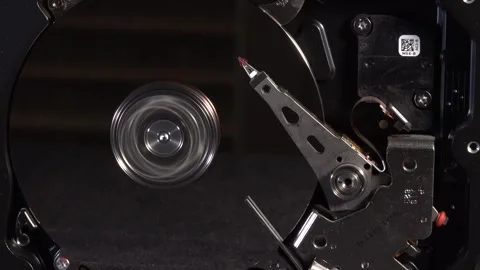 Close-up top view of a spinning open hard drive - C0035 Stock Footage 320837010