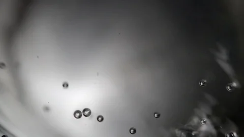 Close up, top view on the surface of sparkling water with gentle gas bubbles. Stock Footage 111754015