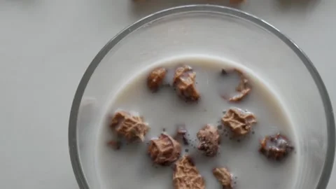 Close-up top view of tiger nut horchata in a glass with floating tiger nuts Stock Footage 311436692