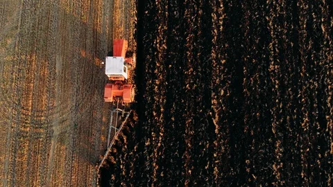 Close up top view tractor plowing fields, preparing land for sowing. Aerial view Stock Footage 116236717