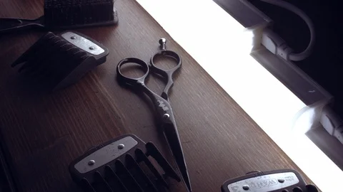 Close-up top view trimming accessories nozzles and scissors lie on the table Stock Footage 112335938