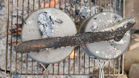 Close up top view of two camping pots over burning fire. Baking on fire Stock Footage 271628429