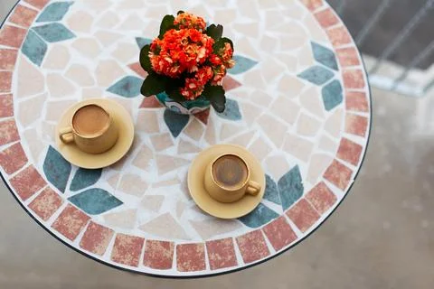 Close-up top view of two small cups of coffee on table. Stock Photos