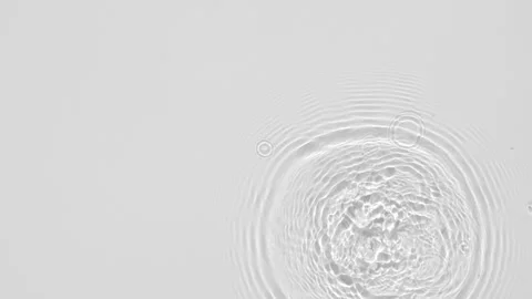 Close up top view of water droplets falling into water and separate splashes of Stock Footage 148796818