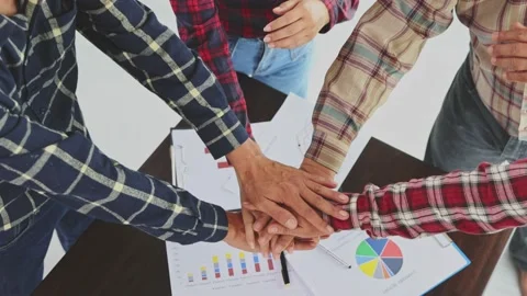 Close up top view of young business people putting their hands together. Stac Stock Footage 201660104