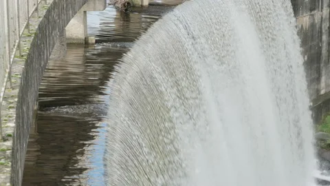 Close up of the top of a waterfall of an overflowing dam. 4K locked tripod Stock Footage 148141070
