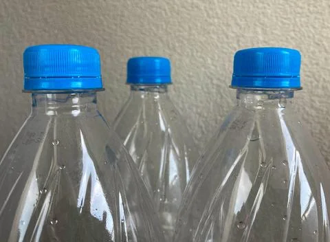 Close-up of the tops of closed plastic bottles. Stock Photos