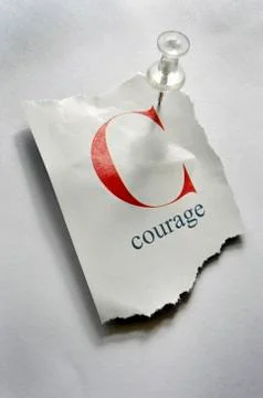 Close-up of Torn Page with C and Courage on it, Pinned to Board Stock Photos
