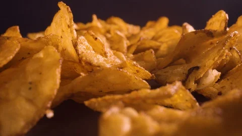 Close-up of tortilla chips on black background Stock Footage 128943685