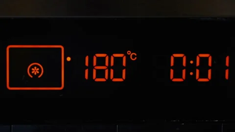 Close-up, touch panel of an electric oven. Temperature control and timer on the Stock Footage 142299831