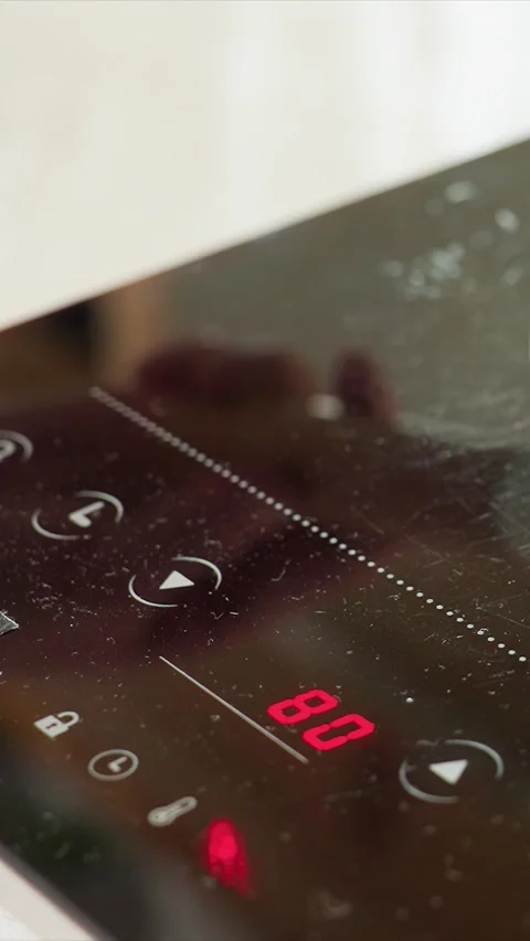 Close up touch sensitive glass control panel showing temperature adjustments and Stock Footage 344420656
