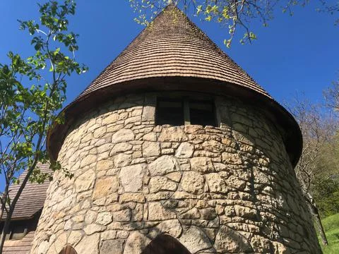 Close up of the tower in form of cone. Made from stones. Stock Photos