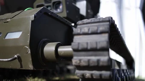 Close up of tracked military ground robot with rugged caterpillar drive for diff Stock Footage 346451412