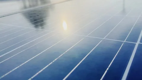 Close Up Tracking Shot Across Solar Panel Surface With Sunlight Reflection and Stock Footage 340827725