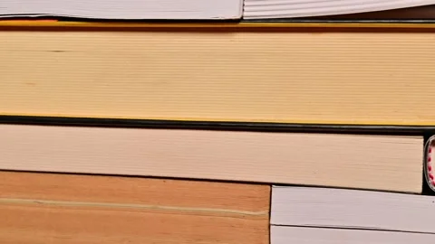 Close up tracking shot of books stack in a library bookstore Stock Footage 165420958