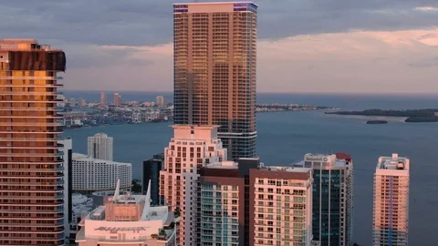 Close Up Tracking Shot of the Brickell Skyline at Sunset Facing Beach Stock Footage 112836311