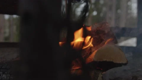 Close up tracking shot of fire burning in outdoor fireplace in wintery setting Stock Footage 146266920