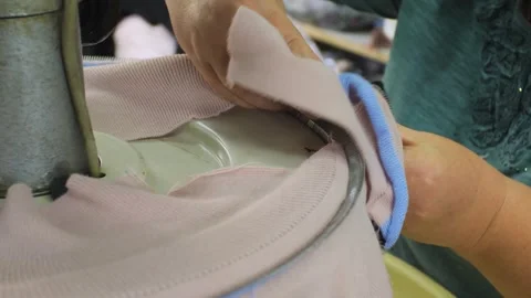 Close-up tracking shot of hand weaving machine producing fabric in textile fa Stock Footage 279879197