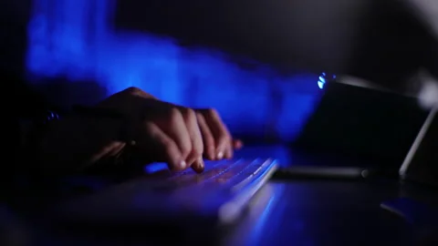 Close-up tracking shot of hands of unrecognizable hacker programmer working Stock Footage 196167924