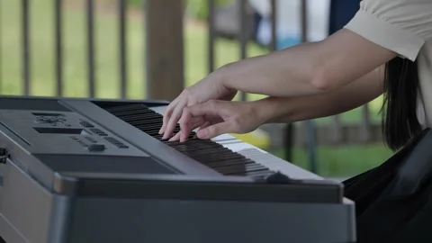 Close-up tracking shot of pianist playing gentle Stock Footage 313673902