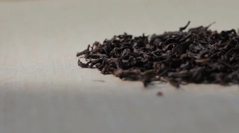 Close-up tracking shot of premium oolong tea Da Hong Pao tea leaves pile Stock Footage 50965154