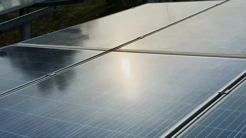 Close Up Tracking Shot of Solar Panel With Sunlight Reflection on Photovoltaic Stock Footage 340827867