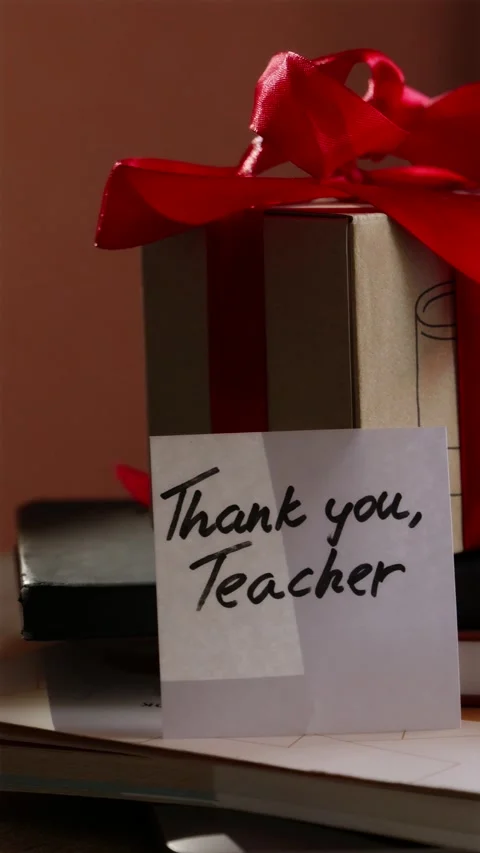 Close up tracking shot of Teacher appreciation gift on desk vertical Stock Footage 340139058