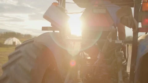 Close up of tractor driving in golden light 库存影片 219405280
