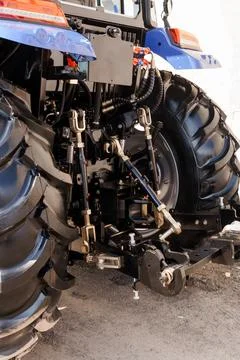 Close up of tractor hydraulic system and mechanical hitch for farming and hea Stock Photos