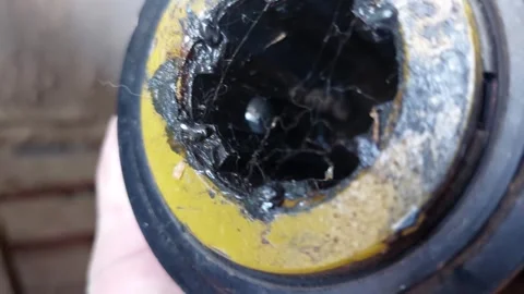 Close up of a tractor PTO shaft coupling with grease and spider web Vídeos de archivo 333641810