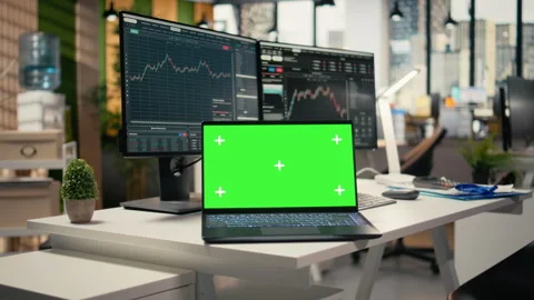 Close up of trading software in forex office with graphs on green screen laptop Stock Footage 315141385