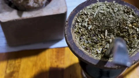 Close-up of Traditional Argentine Mate Tea in Wooden Cup on Rustic Table Stock Footage 345470159