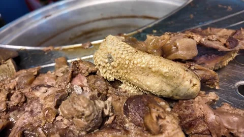 Close Up of Traditional Braised Duck Head and Meat at Thai Street Food Stall 動画素材 336902940
