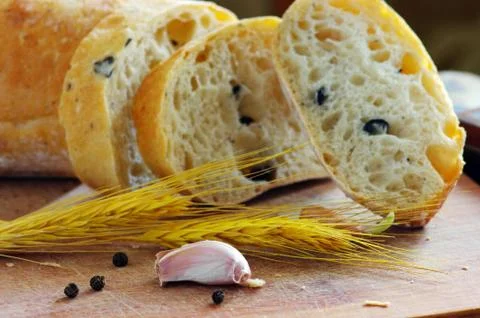 Close-up on traditional bread with olive. Shallow DOF Stock Photos