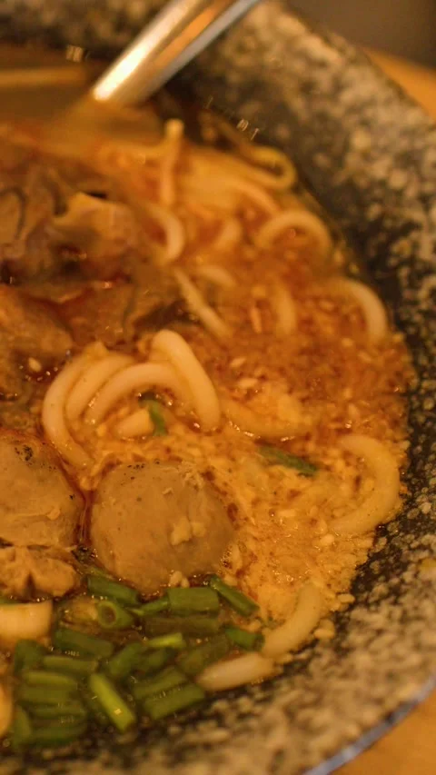 Close Up of Traditional Burmese Beef Mee Shay Noodle Soup Stock Footage 345486601