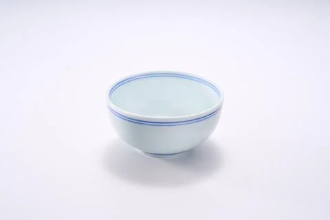 Close-up of traditional double-line shape blue and white ceramic rice bowl .. Stock Photos