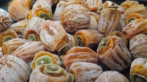 Close-up of Traditional Dried Persimmons Stacked with Natural Sugar Frosting Stock Footage 345291752