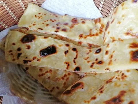 Close up of a traditional Indian flatbread naan which is prepared in a tandoo Stock Photos