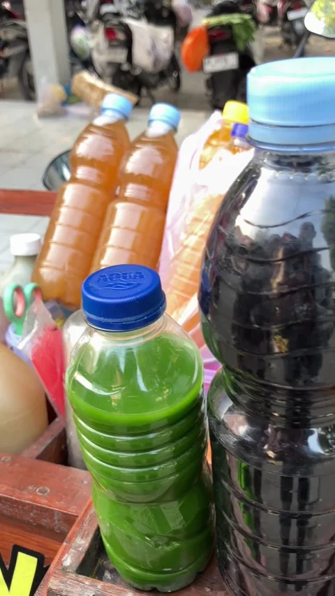 Close Up of Traditional Indonesian Herbal Medicine Jamu in Plastic Bottle 스톡 동영상 337474853