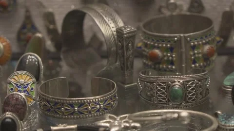 Close Up of Traditional Moroccan Silver Bracelets with Colorful Enamel Patterns Stock Footage 326024105