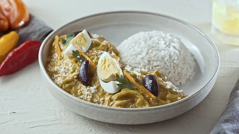 Close-Up of Traditional Peruvian Ají de Gallina with White Rice Stock Footage 341436422