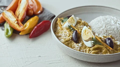 Close-Up of Traditional Peruvian Ají de Gallina with White Rice Stock Footage 341436449