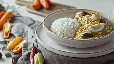 Close-Up of Traditional Peruvian Ají de Gallina with White Rice Stock Footage 341436454
