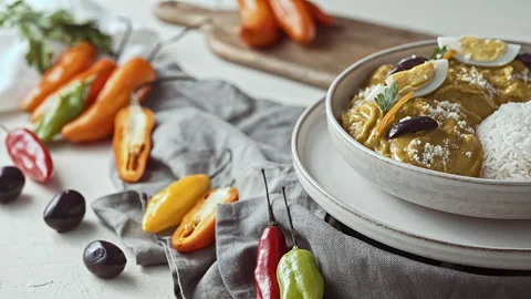 Close-Up of Traditional Peruvian Ají de Gallina with White Rice Stock Footage 341436503