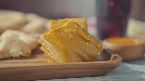 Close-up of Traditional Peruvian Tamale Served on a Wooden Tray Stock Footage 339079031