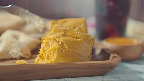 Close-up of Traditional Peruvian Tamale Served on a Wooden Tray Stock Footage 341440929