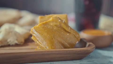 Close-up of Traditional Peruvian Tamale Served on a Wooden Tray Stock-Footage 344989377