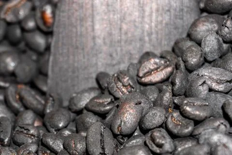 Close up of traditional roasting process of dark black coffee beans Stock Photos