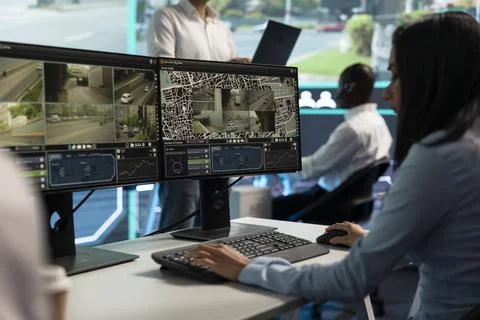 Close up of traffic control operator typing at PC , reviewing live road feeds Stock Photos